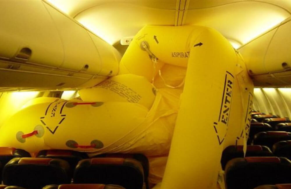 Emergency Slide Inflated Inside The Plane