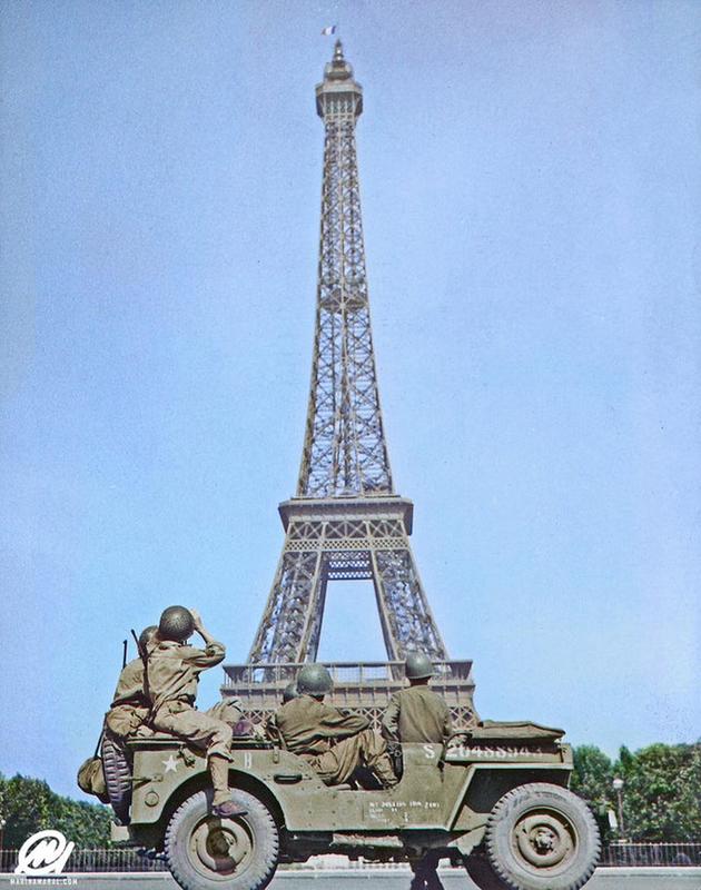 American Soldiers Look At The Tricolor Flag Flying From The Eiffel Tower Again