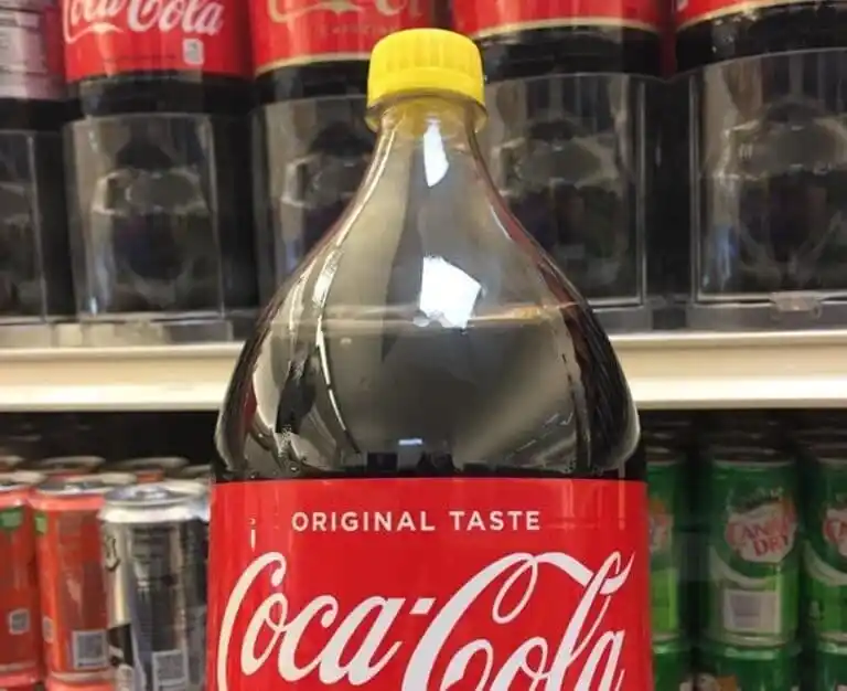 Here's What The Yellow Caps On Soda Bottles Stand For