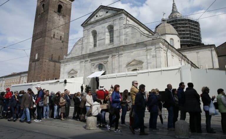 People Wait In Line Before Opening Of Public Exposition Of Shroud Of Turin